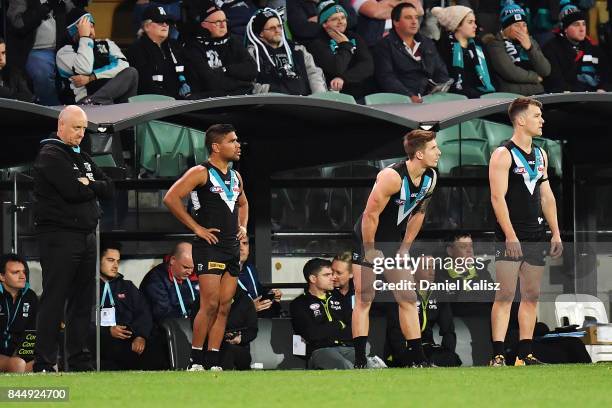 Jake Neade, Hamish Hartlett and Robbie Gray of the Power wait to come back onto the ground in the fourth quarter during the AFL First Elimination...