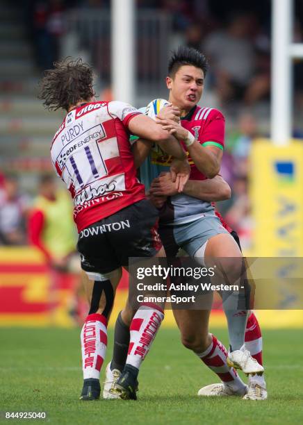 Harlequins' Marcus Smith is tackled by Gloucester Rugby's Henry Purdy during the Aviva Premiership match between Harlequins and Gloucester Rugby at...