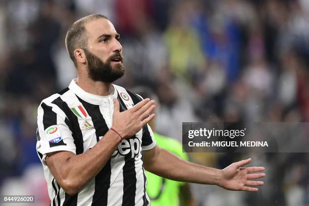 Juventus' Argentinian forward Gonzalo Gerardo Higuain celebrates after scoring during the Italian Serie A football match Juventus vs Chievo at the...