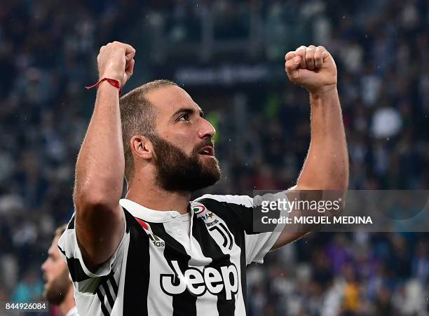 Juventus' Argentinian forward Gonzalo Gerardo Higuain celebrates after scoring during the Italian Serie A football match Juventus vs Chievo at the...