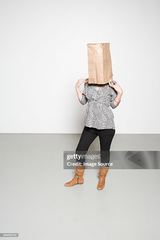 Woman with paper bag on her head