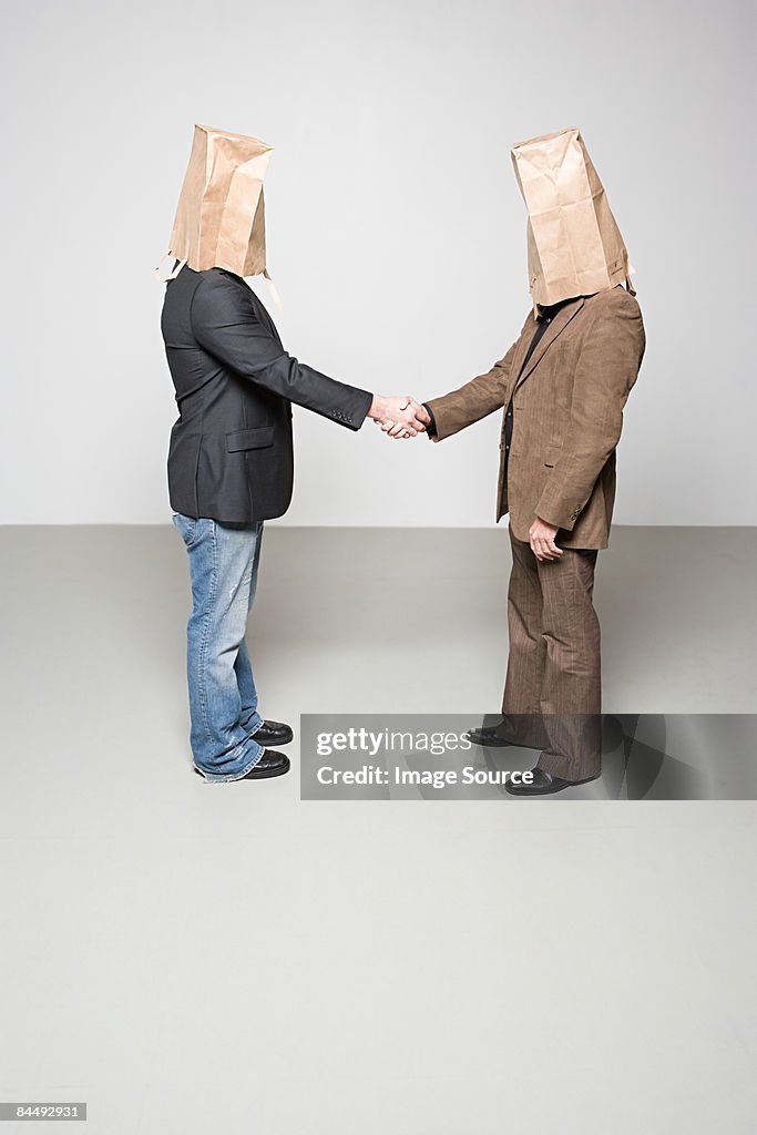 Men with paper bags on their heads