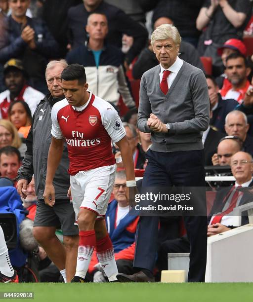 Alexis Sanchez of Arsenal comes on as a sub as Arsene Wenger the Arsenal manager looks on during the Premier League match between Arsenal and AFC...