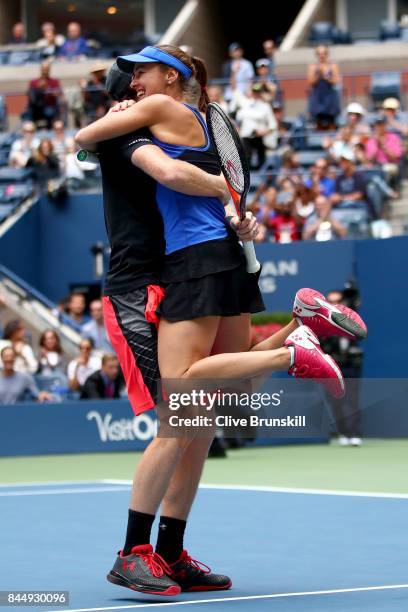 Martina Hingis of Switzerland and Jamie Murray of Great Britain celebrate defeating Hao-Ching Chan of Taiwan and Michael Venus of New Zealand in...