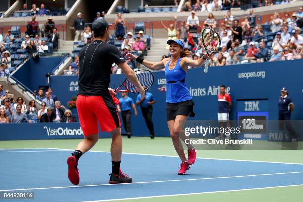 Martina Hingis of Switzerland and Jamie Murray of Great Britain celebrate defeating Hao-Ching Chan of Taiwan and Michael Venus of New Zealand in...