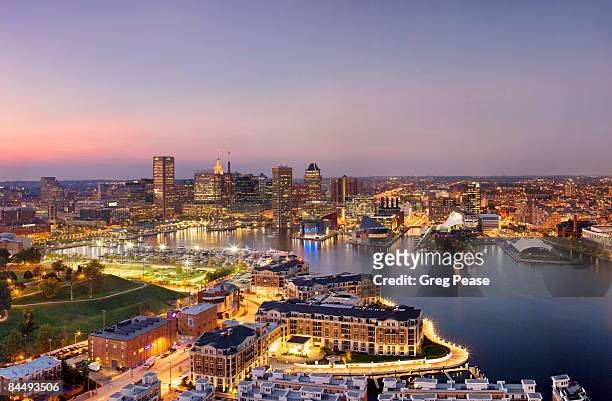 the baltimore skyline and inner harbor, evening - baltimore maryland stock pictures, royalty-free photos & images