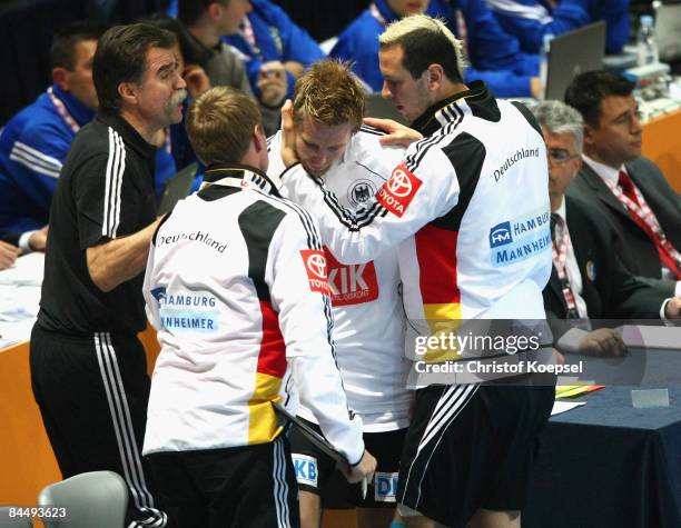 Oliver Roggisch and Pascal Hens of Germany look dejected during the Men's World Handball Championships main round match group two between Germany and...