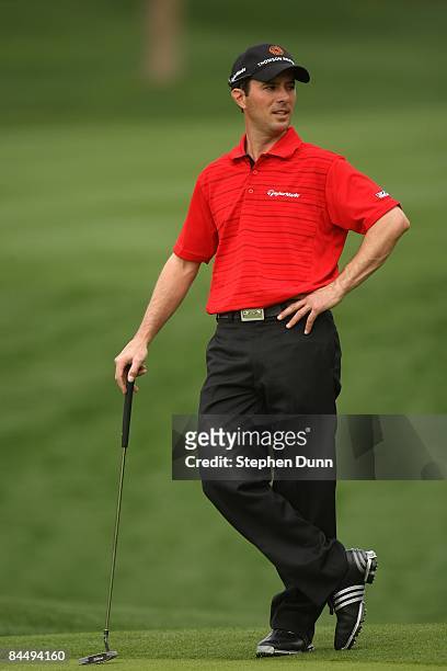 Mike Weir of Canada waits to putt on the seventh hole on the Palmer Private Course at PGA West during the first round of the Bob Hope Chrysler...