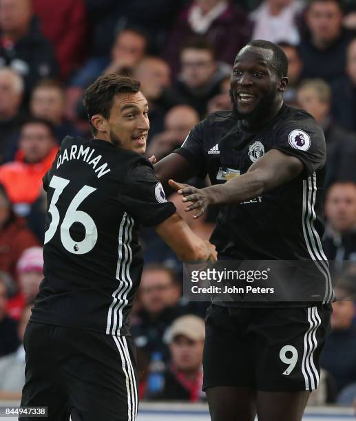 Romelu Lukaku of Manchester United celebrates scoring their second goal during the Premier League match between Stoke City and Manchester United at...