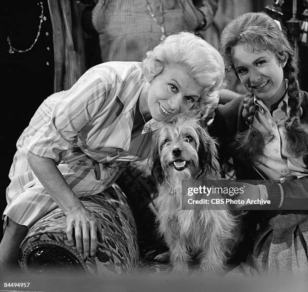 Promotional portrait of American actresses Bea Benaderet , as Kate Bradley, and Linda Henning, as Betty Jo Bradley Elliot, along with canine actor...