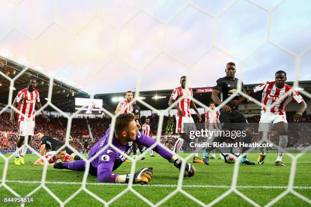 Jack Butland of Stoke City makes a save during the Premier League match between Stoke City and Manchester United at Bet365 Stadium on September 9,...