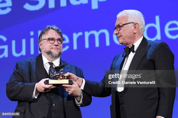 Guillermo del Toro receives the Golden Lion for Best Film Award for 'The Shape Of Water' from President of the festival Paolo Baratta during the...