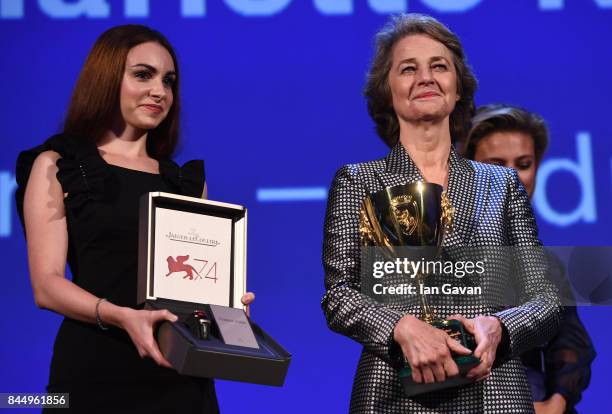 Actress Charlotte Rampling receives the Coppa Volpi for Best Actress Award for 'Hannah' and a Jaeger-LeCoultre Unique engraved Reverso watch during...