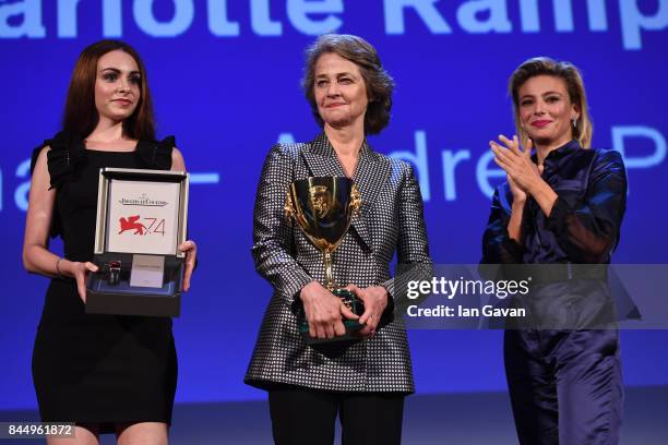 Actress Charlotte Rampling receives the Coppa Volpi for Best Actress Award for 'Hannah' from 'Venezia 74' jury member Jasmine Trinca and a...