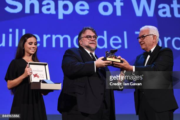 Director Guillermo del Toro receives the Golden Lion for Best Film Award for 'The Shape Of Water' from President of the festival Paolo Baratta and a...