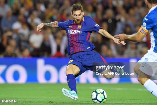 Barcelona's Argentinian forward Lionel Messi scores a goal during the Spanish Liga football match Barcelona vs Espanyol at the Camp Nou stadium in...