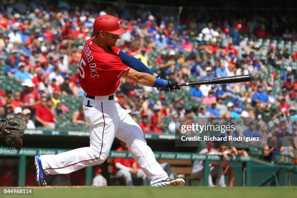 Will Middlebrooks of the Texas Rangers gets a hit in his team debut against the Los Angeles Angels of Anaheim at Globe Life Park in Arlington on...