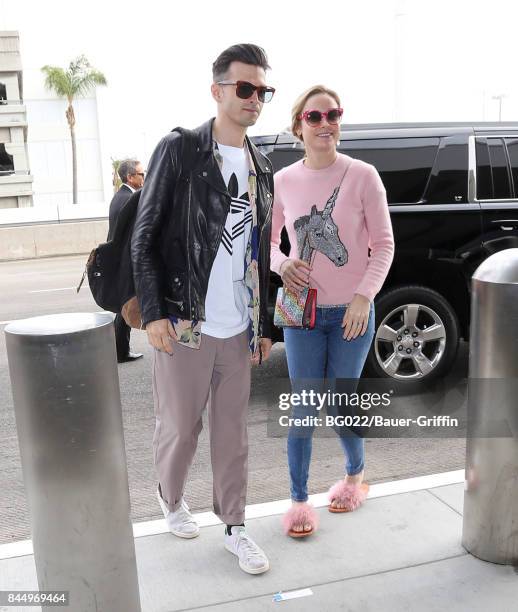 Alex Greenwald and Brie Larson are seen at LAX on September 09, 2017 in Los Angeles, California.