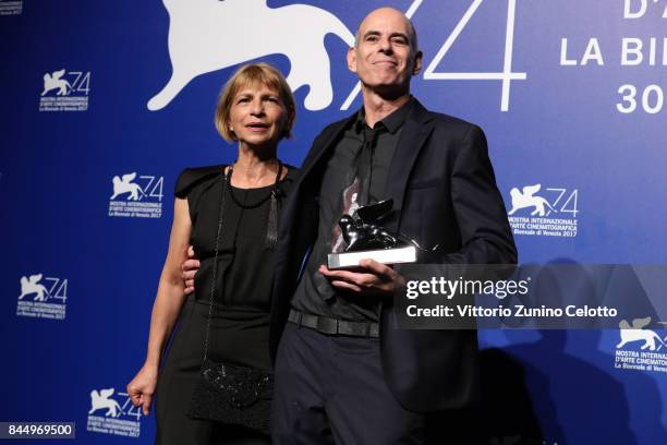 Laura Maoz and Samuel Maoz pose with the Silver Lion - Grand Jury Prize Award for 'Foxtrot' at the Award Winners photocall during the 74th Venice...