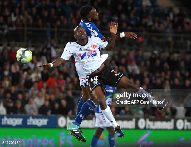 Amien's midfielder Gael Kakuta vies with Strasbourg's French defender Yoann Salmier during the French Ligue 1 football match between Strasbourg and...