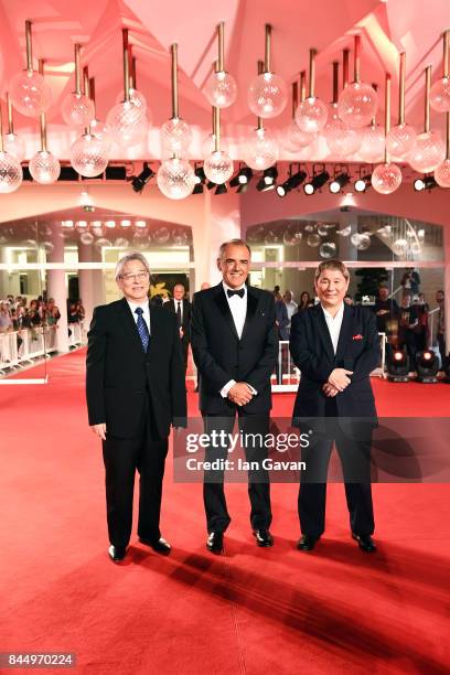 Masayuki Mori, Festival director Alberto Barbera and Takeshi Kitano walk the red carpet ahead of the 'Outrage Coda' screening during the closing...