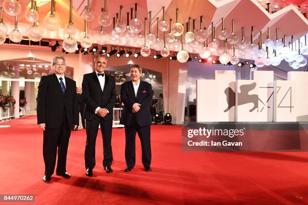 Masayuki Mori, Festival director Alberto Barbera and Takeshi Kitano walk the red carpet ahead of the 'Outrage Coda' screening during the closing...