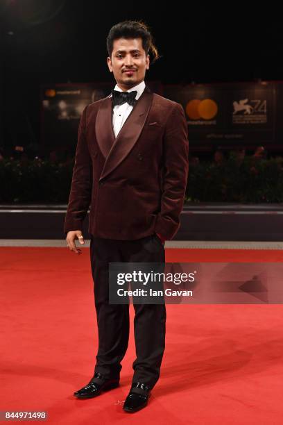 Pritan Ambroase walks the red carpet ahead of the 'Outrage Coda' screening during the closing night of the 74th Venice Film Festival at Sala Grande...