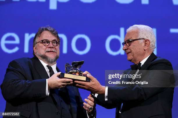 Director Guillermo del Toro receives the Golden Lion for Best Film Award for 'The Shape Of Water' from President of the festival Paolo Baratta during...