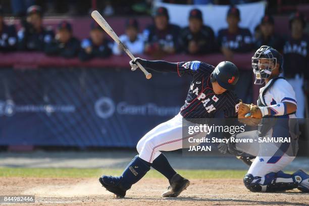 Kosuteke Ito of Japan avoids a wild pitch during the ninth inning of a game against Korea during the WBSC U-18 Baseball World Cup Super Round game...