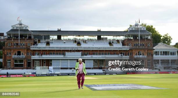 Test Match Special commentator Henry Blofeld walks across the outfield for a final time after day three of the 3rd Investec Test match between...