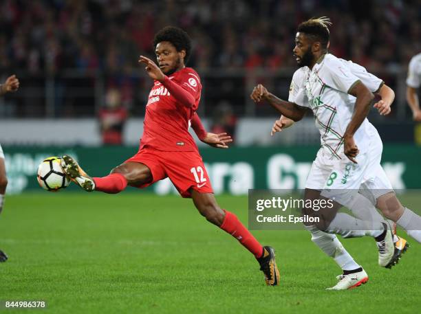 Luiz Adriano of FC Spartak Moscow vies for the ball with Alex Song of FC Rubin Kazan during the Russian Premier League match between FC Spartak...