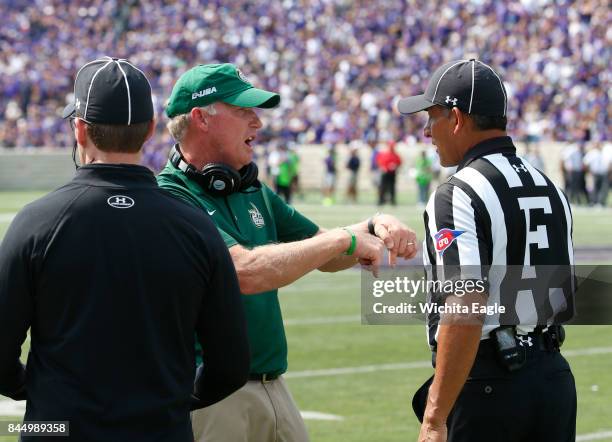 Charlotte head coach Brad Lambert argues a call in the second half during a 55-7 loss against Kansas State at Snyder Family Stadium in Manhattan,...