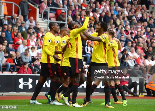 Abdoulaye Doucoure of Watford celebrates scoring thier first goal with Nathaniel Chalobah of Watford during the Premier League match between...