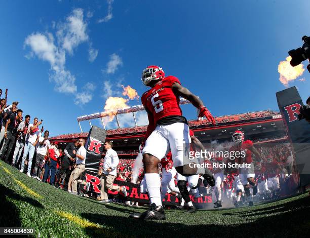 Deonte Roberts of the Rutgers Scarlet Knights leads his team onto the field for their game against the Eastern Michigan Eagles on September 9, 2017...