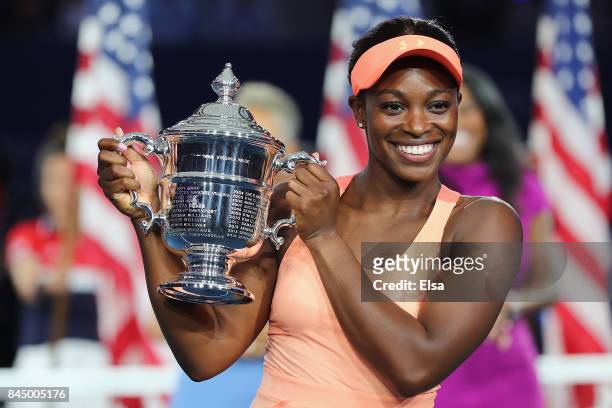 Sloane Stephens of the United States poses with the championship trophy during the trophy presentation after the Women's Singles finals match on Day...