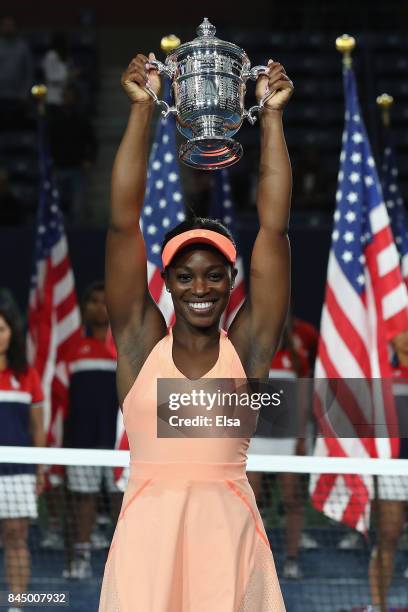 Sloane Stephens of the United States poses with the championship trophy during the trophy presentation after the Women's Singles finals match on Day...