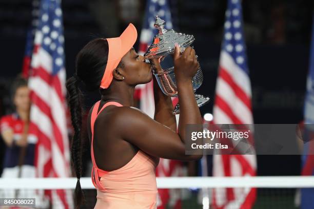 Sloane Stephens of the United States kisses the championship trophy during the trophy presentation after the Women's Singles finals match on Day...