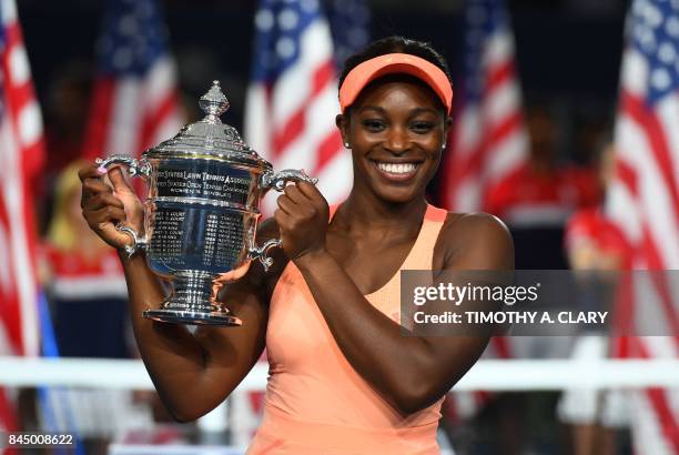 Sloane Stephens of the US celebrates with her winning trophy after defeating compatriot Madison Keys in their 2017 US Open Women's Singles final...