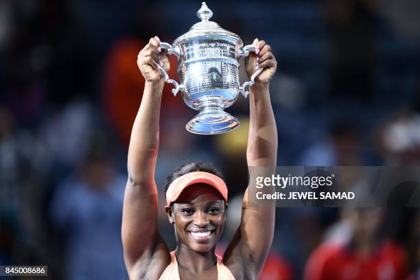 Sloane Stephens of the US poses with her winning trophy after defeating compatriot Madison Keys in their 2017 US Open Women's Singles final match at...