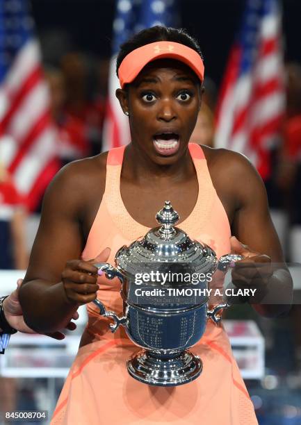 Sloane Stephens of the US celebrates with her winning trophy after defeating compatriot Madison Keys during their 2017 US Open Women's Singles final...