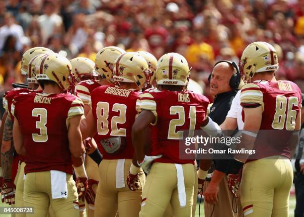 Head Coach Steve Addazio of the Boston College Eagles talks to the team in the second quarter of the game against the Wake Forest Demon Deacons at...