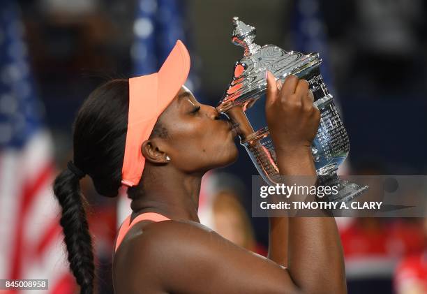 Sloane Stephens of the US kisses her winning trophy after defeating compatriot Madison Keys in their 2017 US Open Women's Singles final match at the...