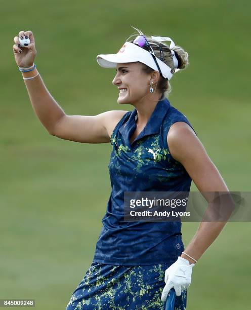 Lexi Thompson celebrates after winning the Indy Women In Tech Championship-Presented By Guggenheim at the Brickyard Crossing Golf Course on September...