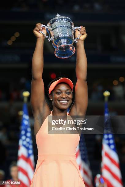 Sloane Stephens of the United States poses with the championship trophy during the trophy presentation after defeating Madison Keys of the United...