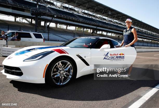 Lexi Thompson poses with a pace car that she was preparing to drive after winning the Indy Women In Tech Championship-Presented By Guggenheim at the...