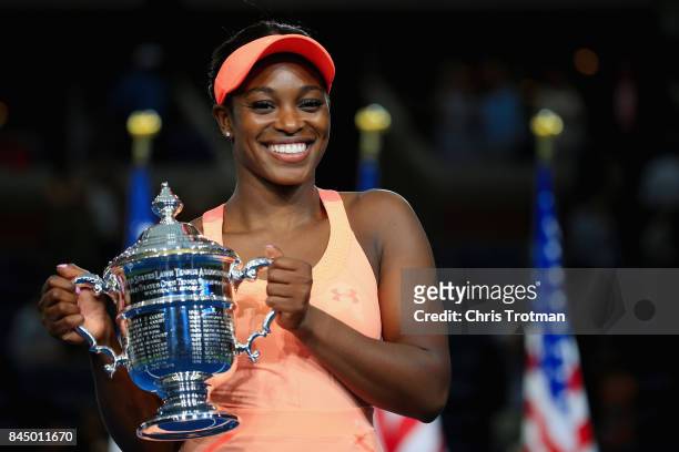 Sloane Stephens of the United States poses with the championship trophy during the trophy presentation after defeating Madison Keys of the United...