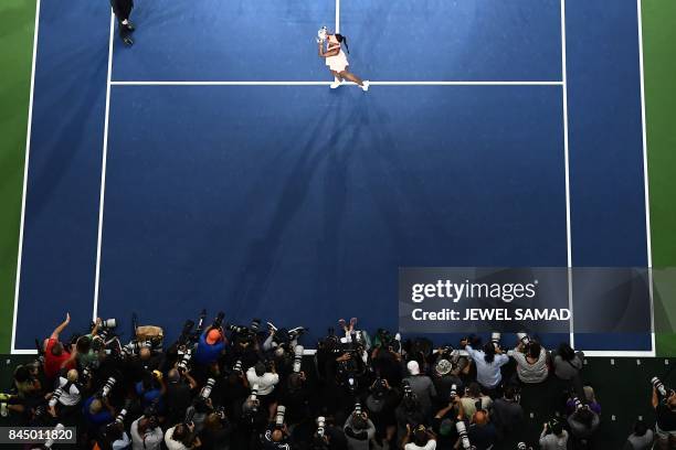 Sloane Stephens of the US poses with her winning trophy after defeating compatriot Madison Keys during their 2017 US Open Women's Singles final match...