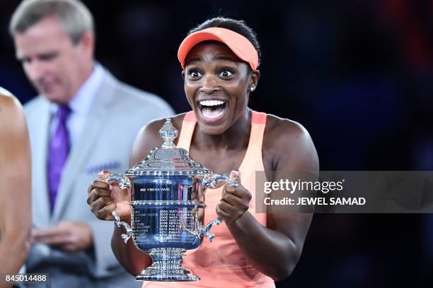 Sloane Stephens of the US reacts with winning trophy after defeating compatriot Madison Keys in their 2017 US Open Women's Singles final match at the...