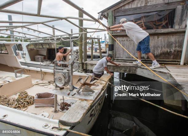 Commercial fisherman secure their boats in preparation for Hurricane Irma on September 9, 2017 in the Florida panhandle town of St Marks, Florida....
