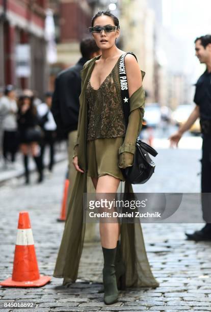 Janie Tienphosuwan is seen wearing a Sally Lapointe dress, Yeezy shoes, Givenchy bag and Gentlemonster sunglasses outside the Rebecca Minkoff show...